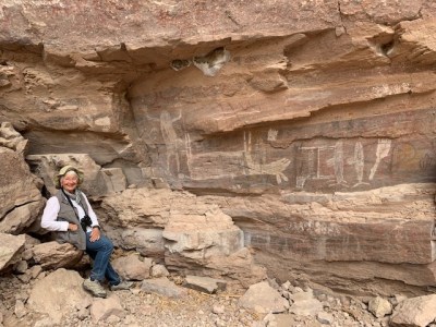 a man sitting on a rock