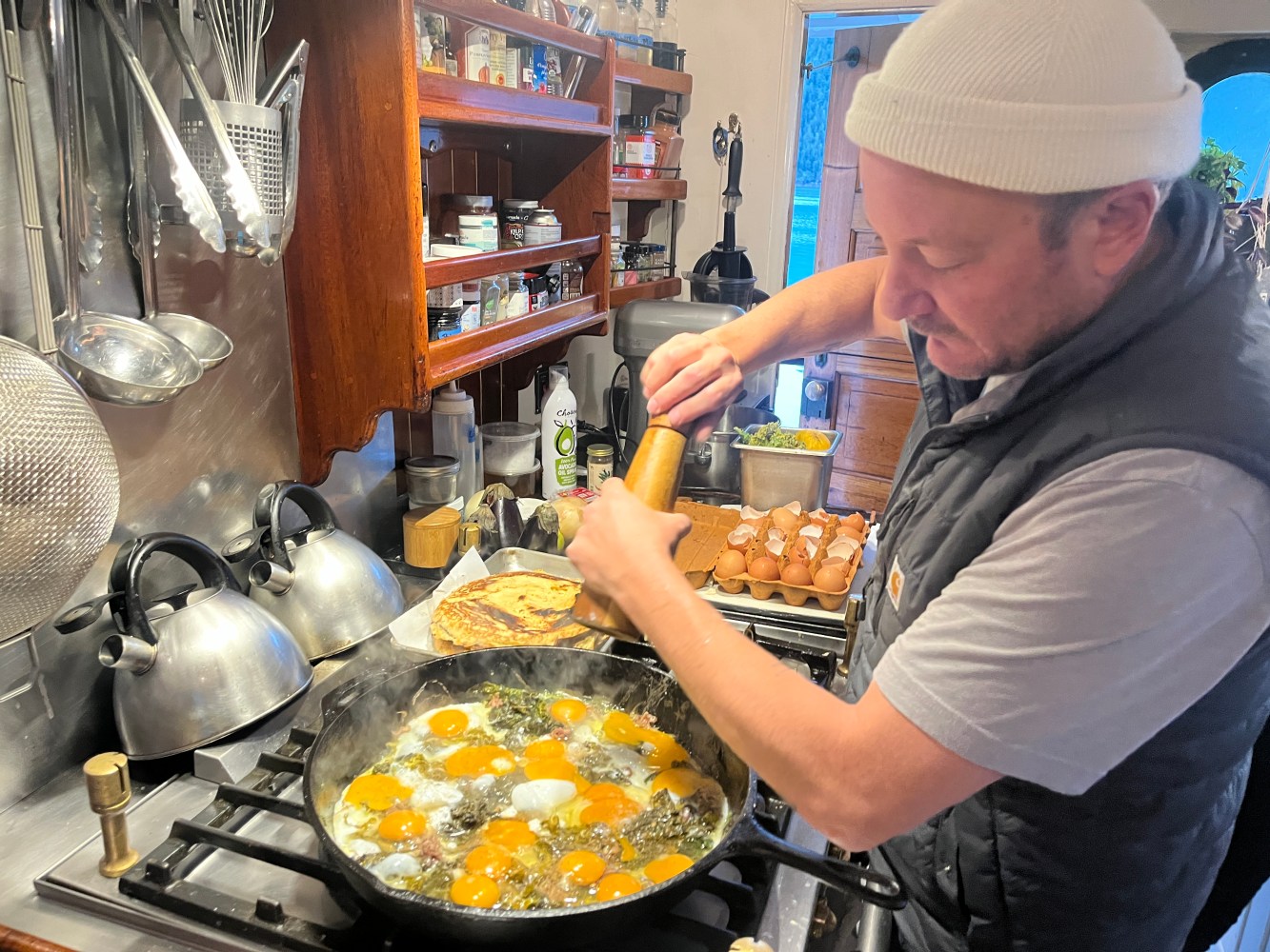 a person cooking in a kitchen preparing food